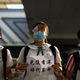 A student covers her eye during a human-chain rally in Hong Kong’s Sha Tin district in support of a female protester who earlier was allegedly shot in the eye by police.